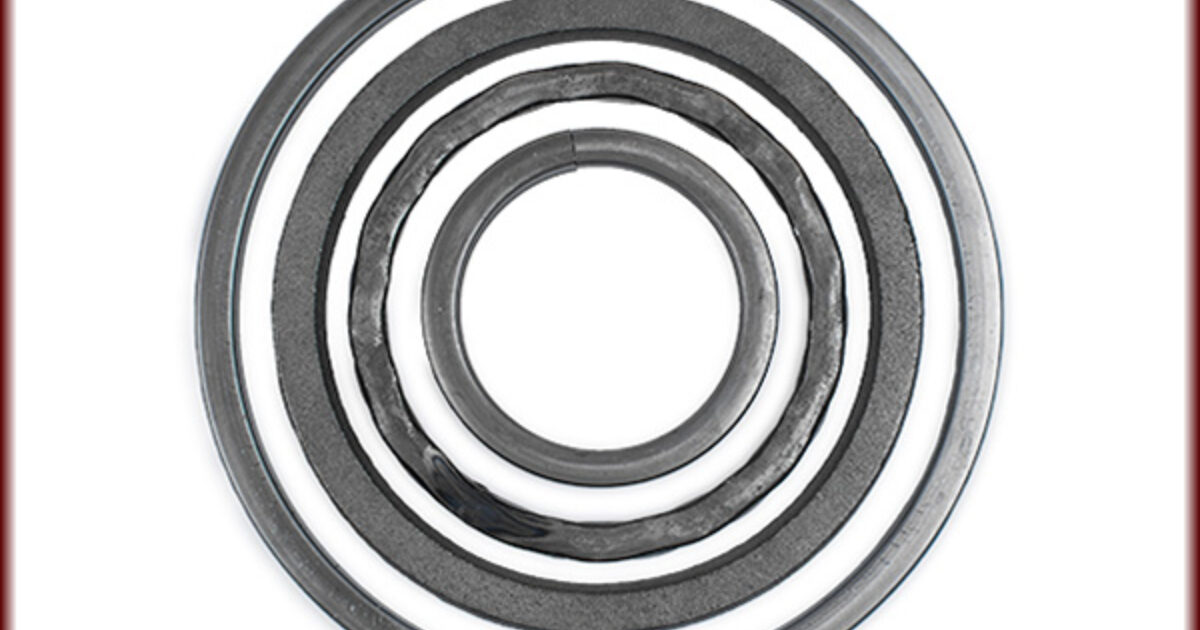 Ring made of steel - band with circles and lines, obliquely cut edges