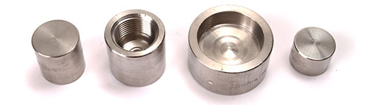 Four different sizes of _Forged Stainless Socket Weld Caps