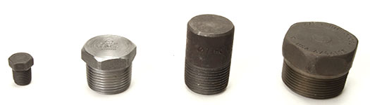 Four different Forged Steel Plugs with hex heads and round heads.