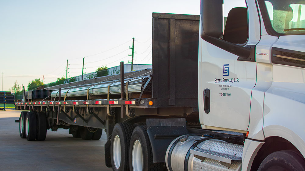 Steel Supply truck delivering structural steel to Victoria, Texas